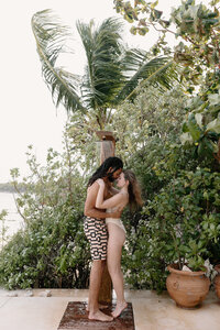 mother and bride hugging