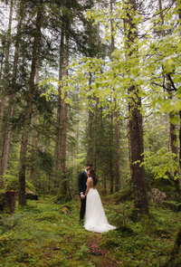 Bride and groom hugging austria alps