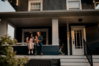 Outdoor family photoshoot in Omaha park during golden hour – capturing candid, heartfelt moments.