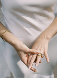 bride repositioning her wedding rings