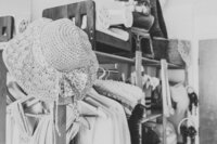 Hanging knitted baby hats and clothes. Ruaa Hamdan Photography.