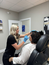 Woman receiving Botox at vIVid
