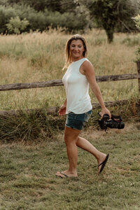 a photo of a family photographer posing at park in Union County, NJ