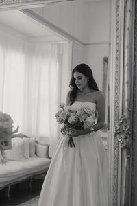 Gabbinbar, Toowoomba bride looking down at her flowers to show her beautifully natural makeup