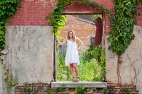 monroe_photographer_a_focused_life_photography_senior_bogart_ga_girl_white_dress_old_building_window_rustic