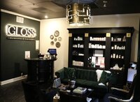 Modern treatment room at Gloss RVA featuring spa equipment