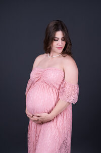lady in white dress in maternity photoshoot