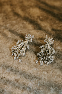Close up look at bridal pearl earrings