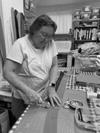 Grandmother sewing heirloom quilt, inspiring Hanna Nicole’s legacy of intentional, timeless brand design for creatives
