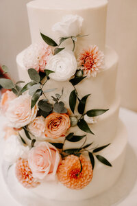 wedding cake with pink and white flowers