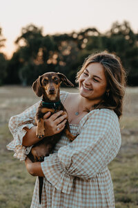 fiance with their dachshund fur baby at engagement shoot