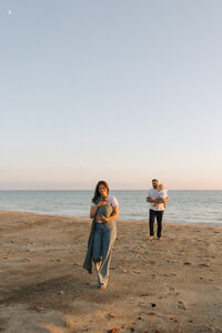 family walking the beach