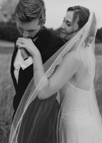 Bride and groom enjoying a cocktail at sunset