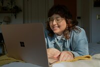 Young woman on computer smiling