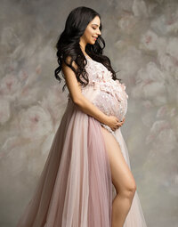 Beautiful mother inside a bathtub with a little baby