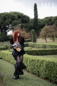 Fashion editorial for ELLE – red-haired model walking through park
