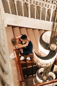 wedding couple under chandelier at Hotel Kansas City