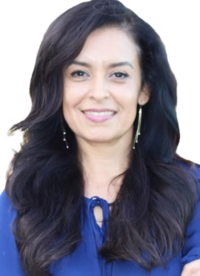 smiling woman with long dark hair social media manager