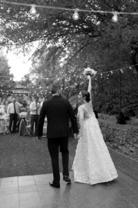 bride and groom enter reception at Chandor Gardens in Weatherford, TX