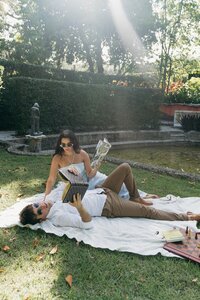 Couple having a picnic in park taken by florida engagement photographer Shelby Ann Photos