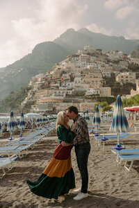 Couple dancing on beach in Positano on the Amalfi Coast