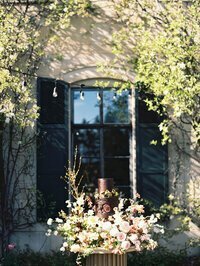Wedding flowers near window taken by chicago wedding photographers Allison Francois
