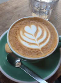 Coffee with foam art shaped like a heart