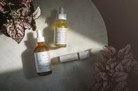Product photo of essential oils with dramatic shadows