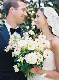 Bride beaming at her groom during a joyful moment in a romantic outdoor wedding in Seattle.