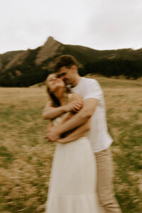 Wedding couple hugging in a forest in Northern Michigan