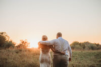 A bride and groom viewing the sunset together at The Barn on Unity Farm in Princeton, West Virginia