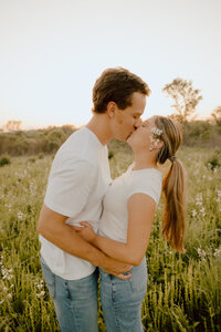 couple kissing during outdoor engagement photos in missouri