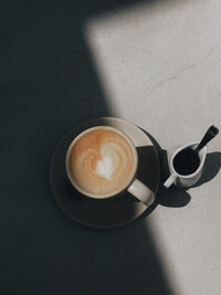 Cup of latte art with shadows