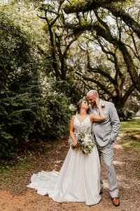 Wedding Photographer in Alabama captures newlyweds in the woods in Mobile, Alabama.