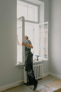 Construction worker fixing a window