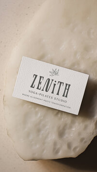 Olive green yoga studio branding on a linen business card.
