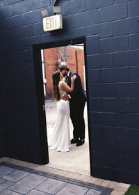 bride and groom kissing