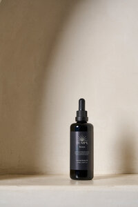 A product marketing photo of Templ body oil, exhibiting Courtney's packaging design, branding and logo design work