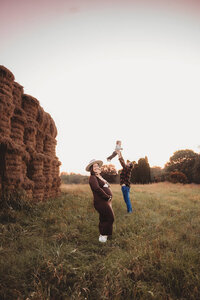 sunset maternity session with mother son and dad