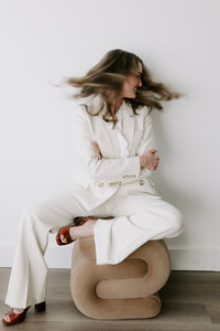 Website copywriter Erika Fitzgerald in a white suit