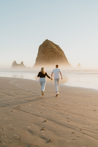 couple running on beach