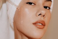 Image of skincare being used on woman's face from Romantic engagement photos_ADP Studio-2