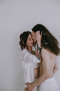 Couple holding each other in studio photoshoot in albuquerque.