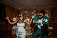 Bride and groom money dance during their wedding reception