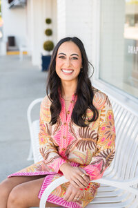 Headshot of Headshot of Dr. Templeton, orthodontist in Nashville, TN, in a pink outfit