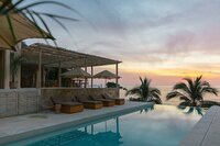 La Joya Sayulita is a secluded oceanside retreat resort in Nayarit offering boutique accommodations, wellness retreats, and local adventure experiences in a serene coastal setting.