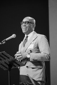 Photo of african american male giving presentation at a conference in Detroit.