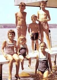 Children posing on dock