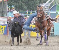 Professional rodeo cowboy Todd Woodward competing while wearing a custom knee brace from Lethbridge Orthotics.