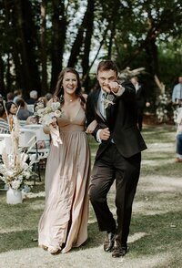 Couple walking down aisle at wedding